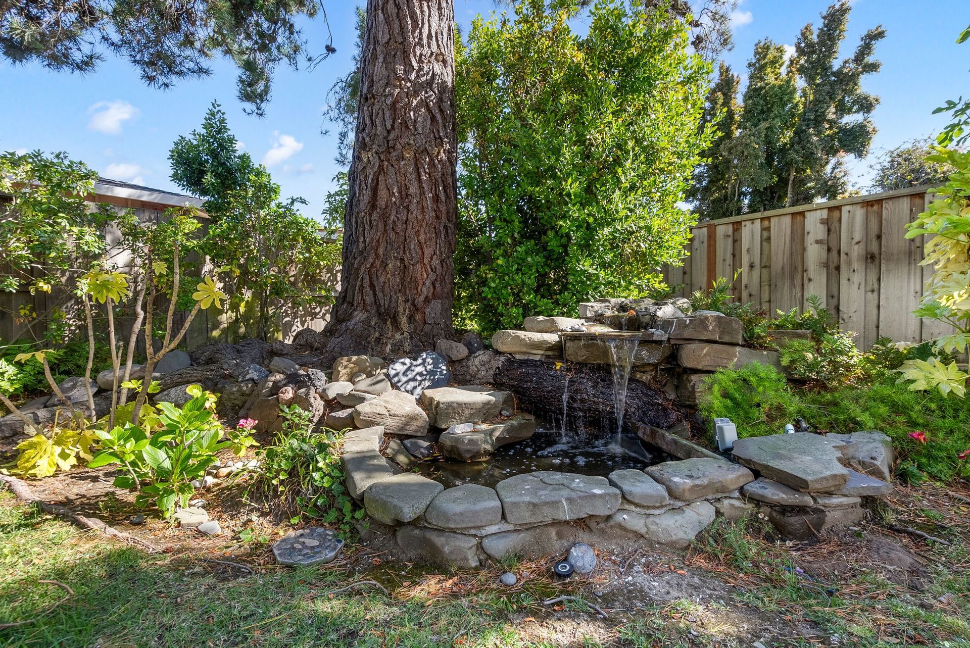 There is a waterfall in the middle of the garden.