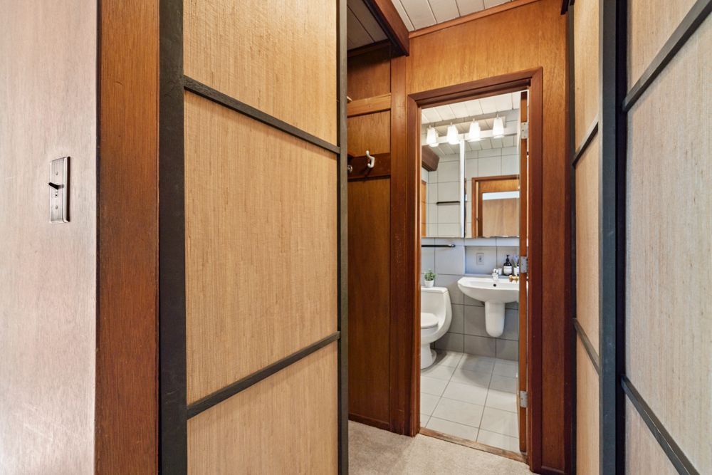 Calm primary bedroom with patio views, dual closets, and ensuite bath — Rumana Jabeen & Associates emphasize comfort for buyers and marketing strength for sellers