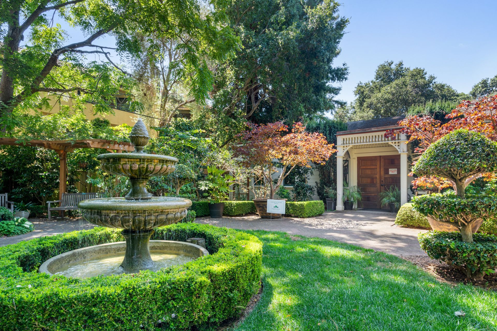 There is a fountain in the middle of the garden.