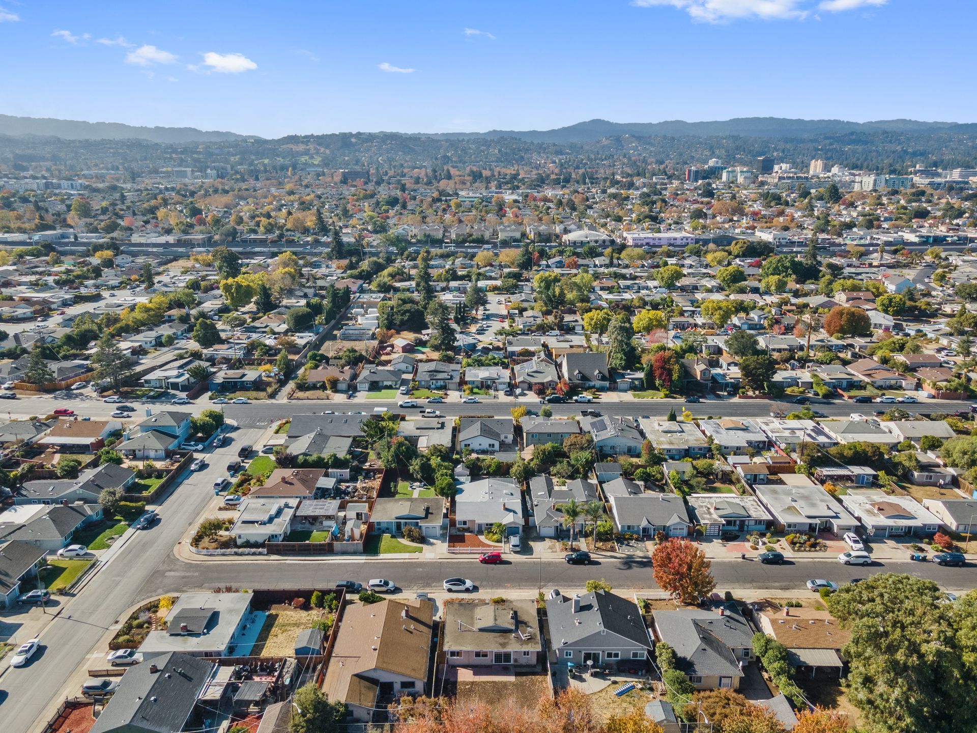 An aerial view of a residential area with lots of houses and trees.