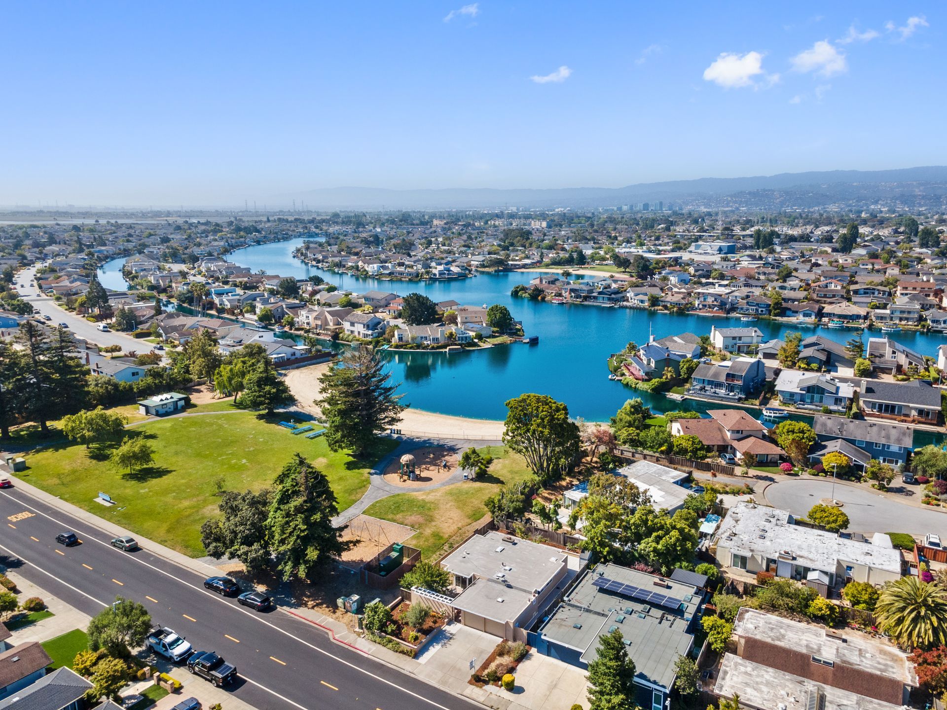 An aerial view of a city with a lake in the middle of it