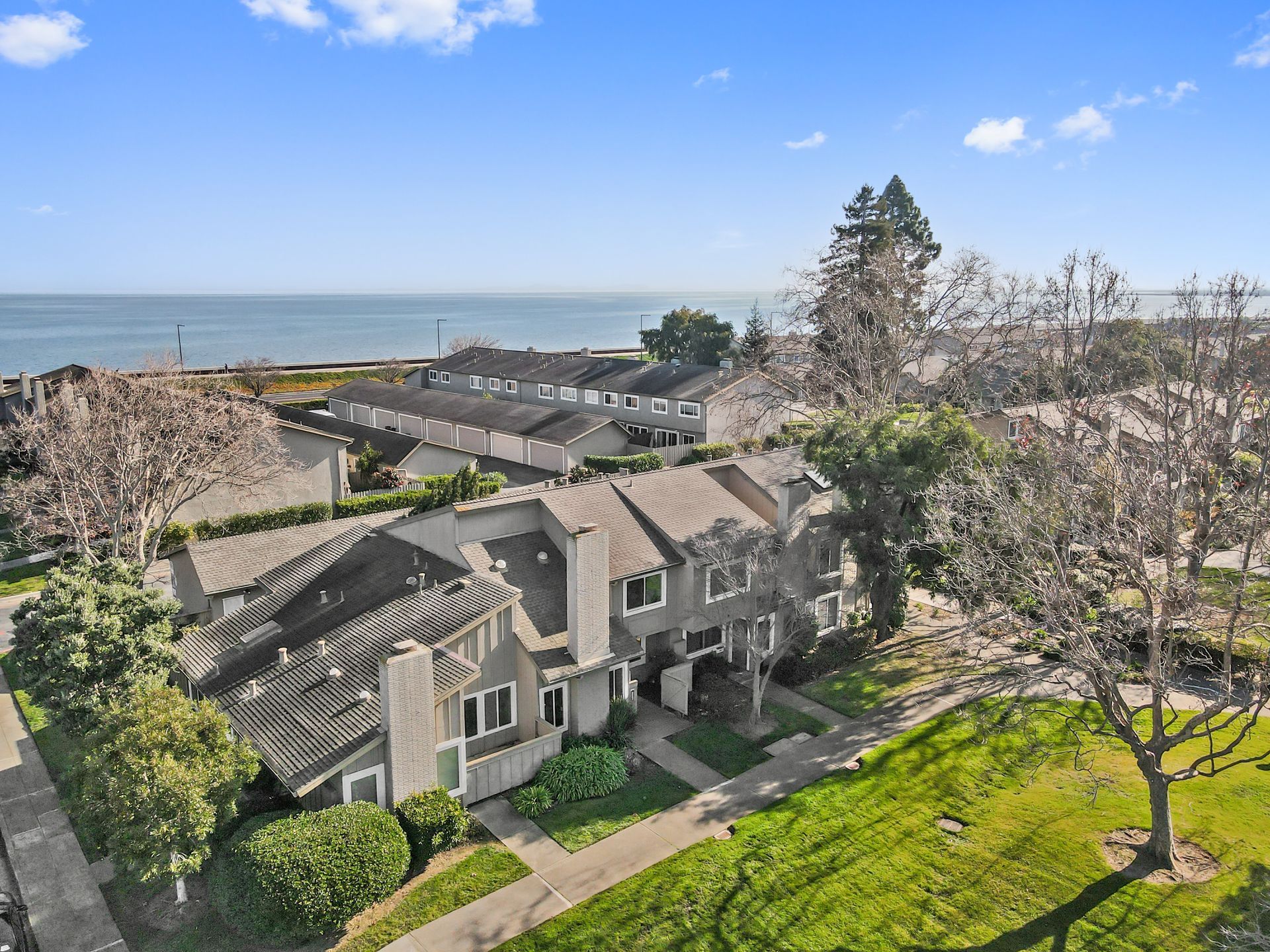 An aerial view of a house with a view of the ocean