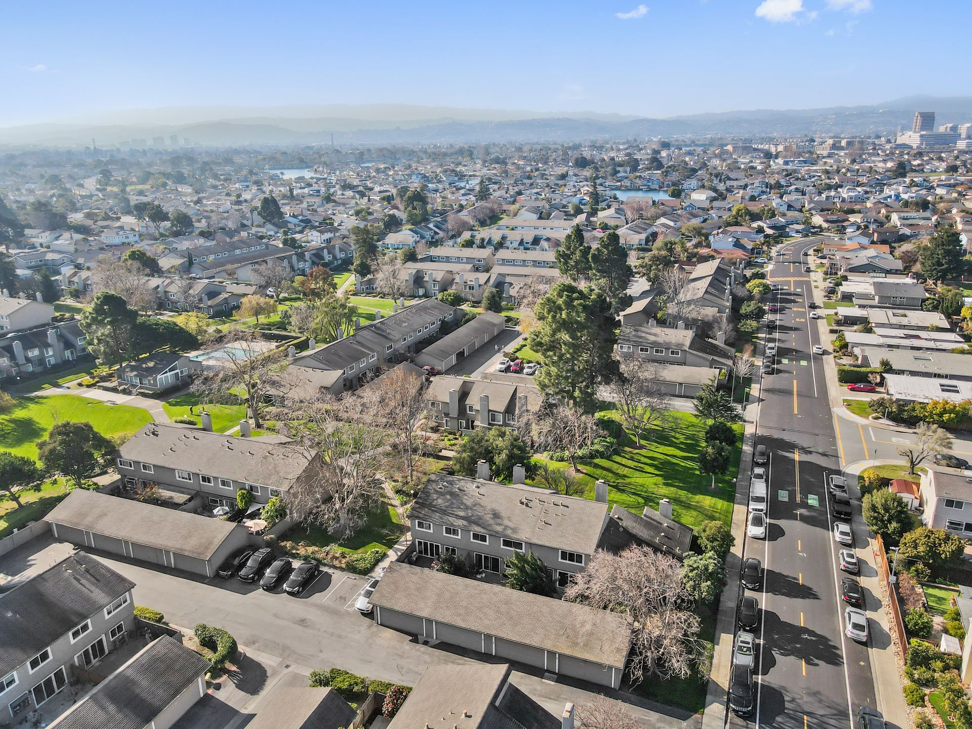 An aerial view of a residential area with lots of houses and trees