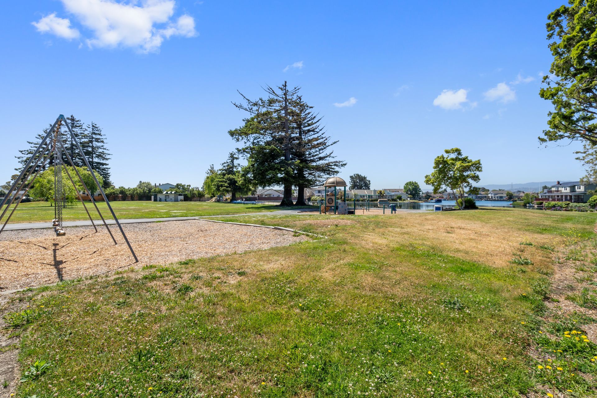 There is a playground in the middle of the park.