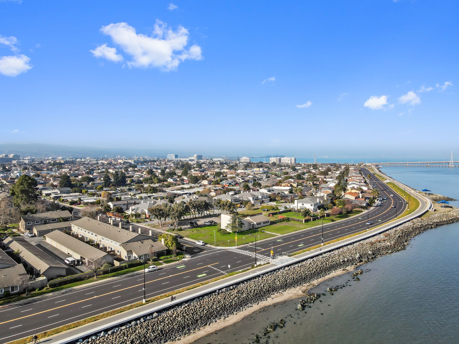 An aerial view of a city next to a body of water.