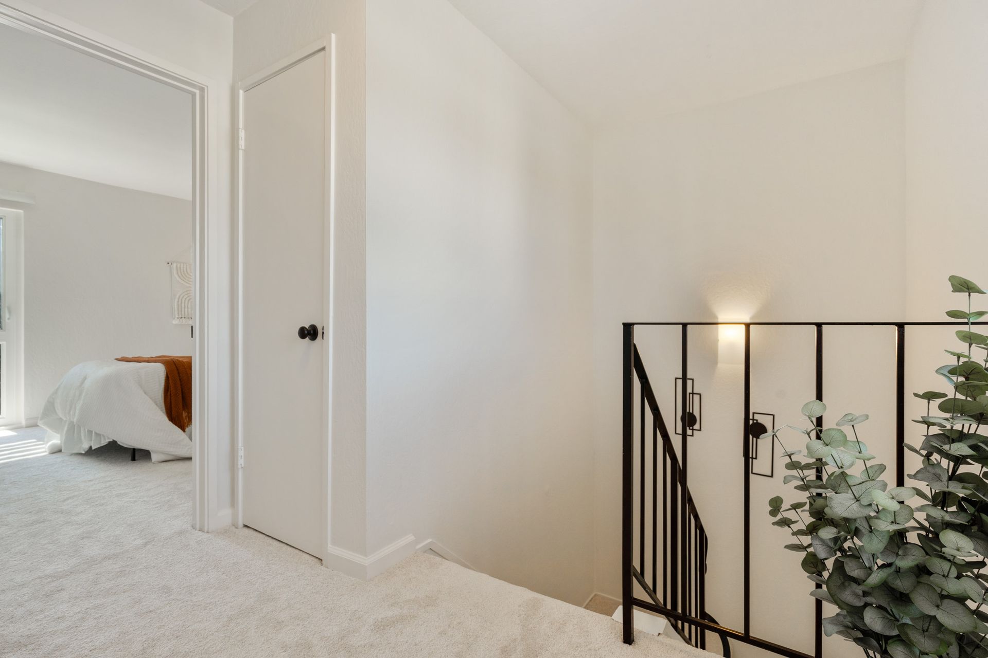 There is a staircase leading up to the second floor of a house.