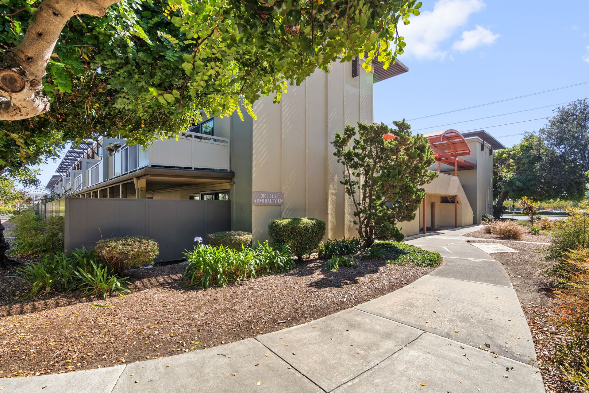 A large white building with a walkway leading to it
