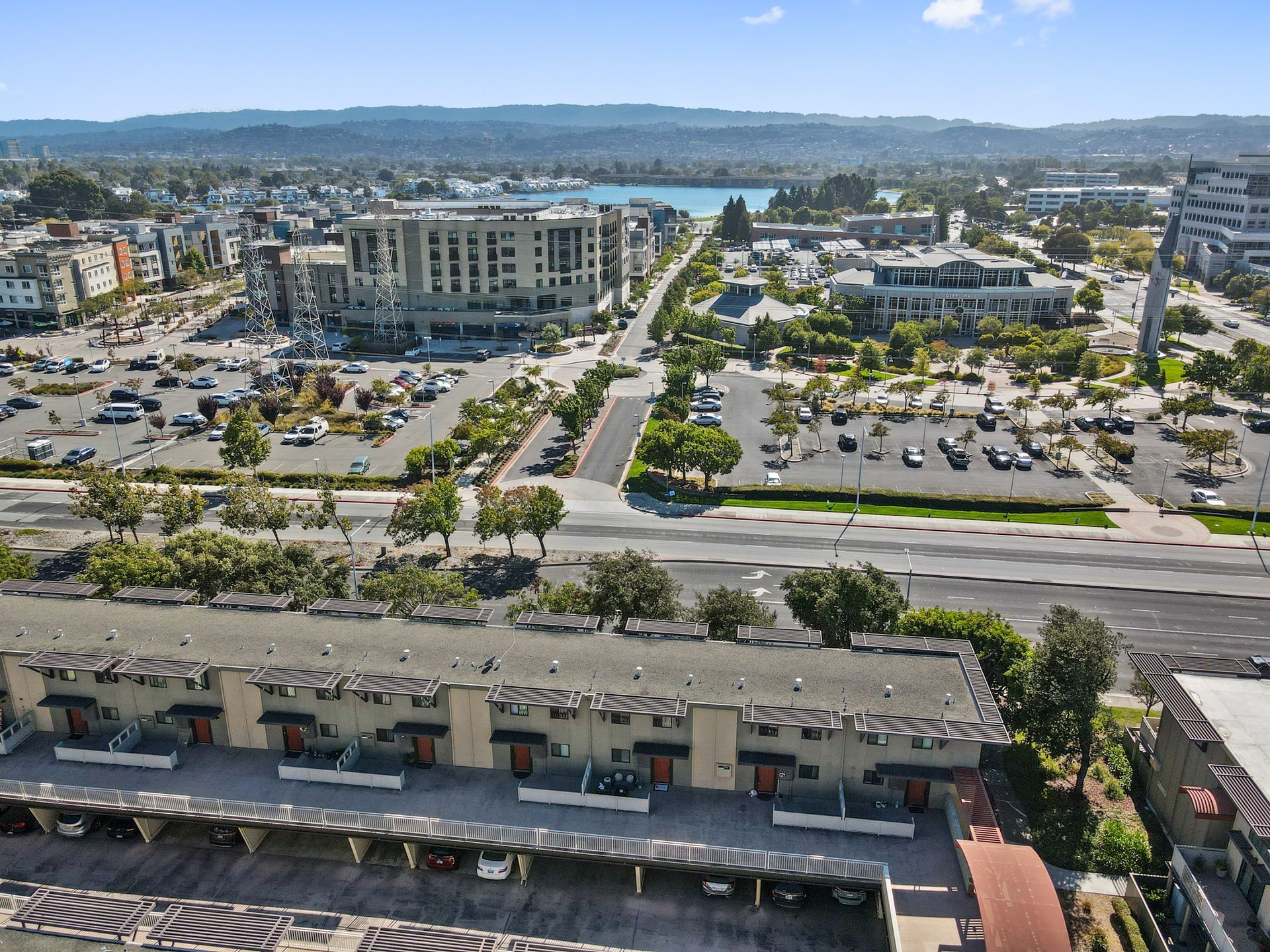 An aerial view of a city with a lot of buildings and parking lots