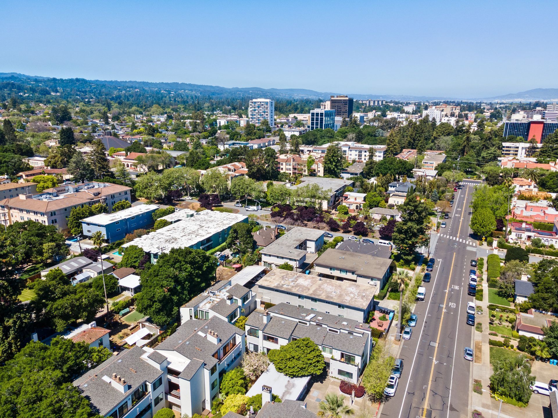 An aerial view of a city with a lot of buildings and trees.