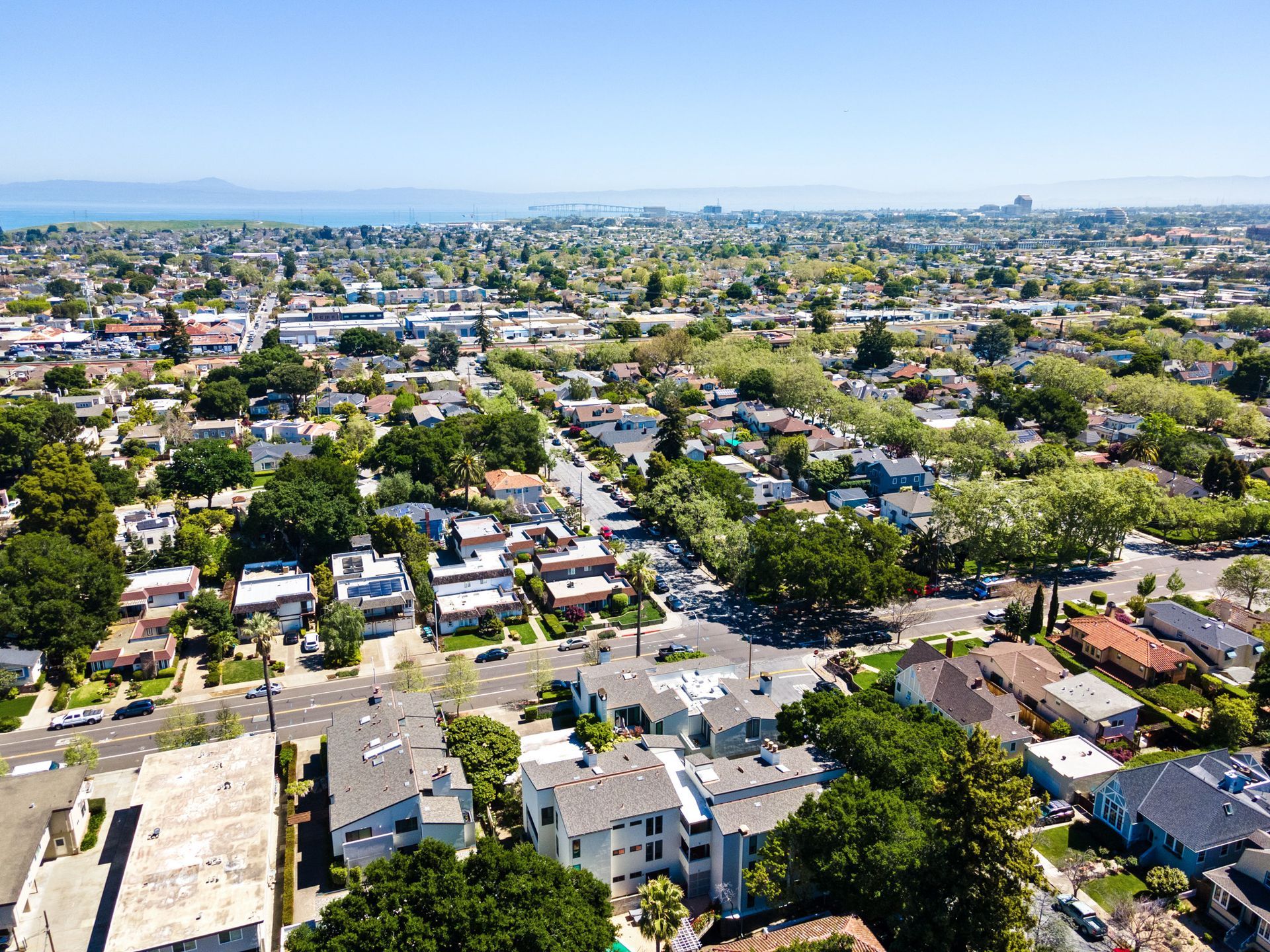 An aerial view of a residential area with lots of houses and trees.
