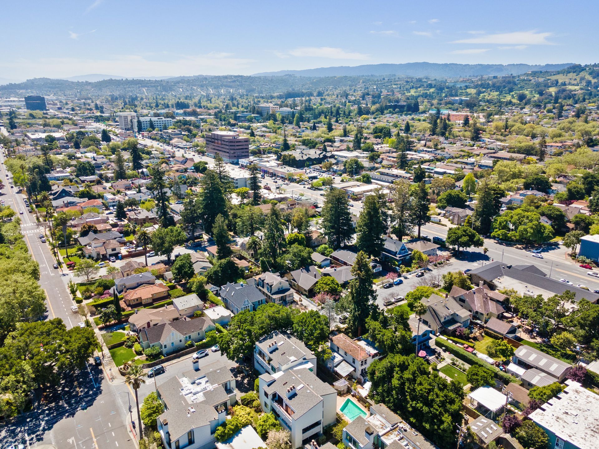 An aerial view of a residential area with lots of houses and trees.