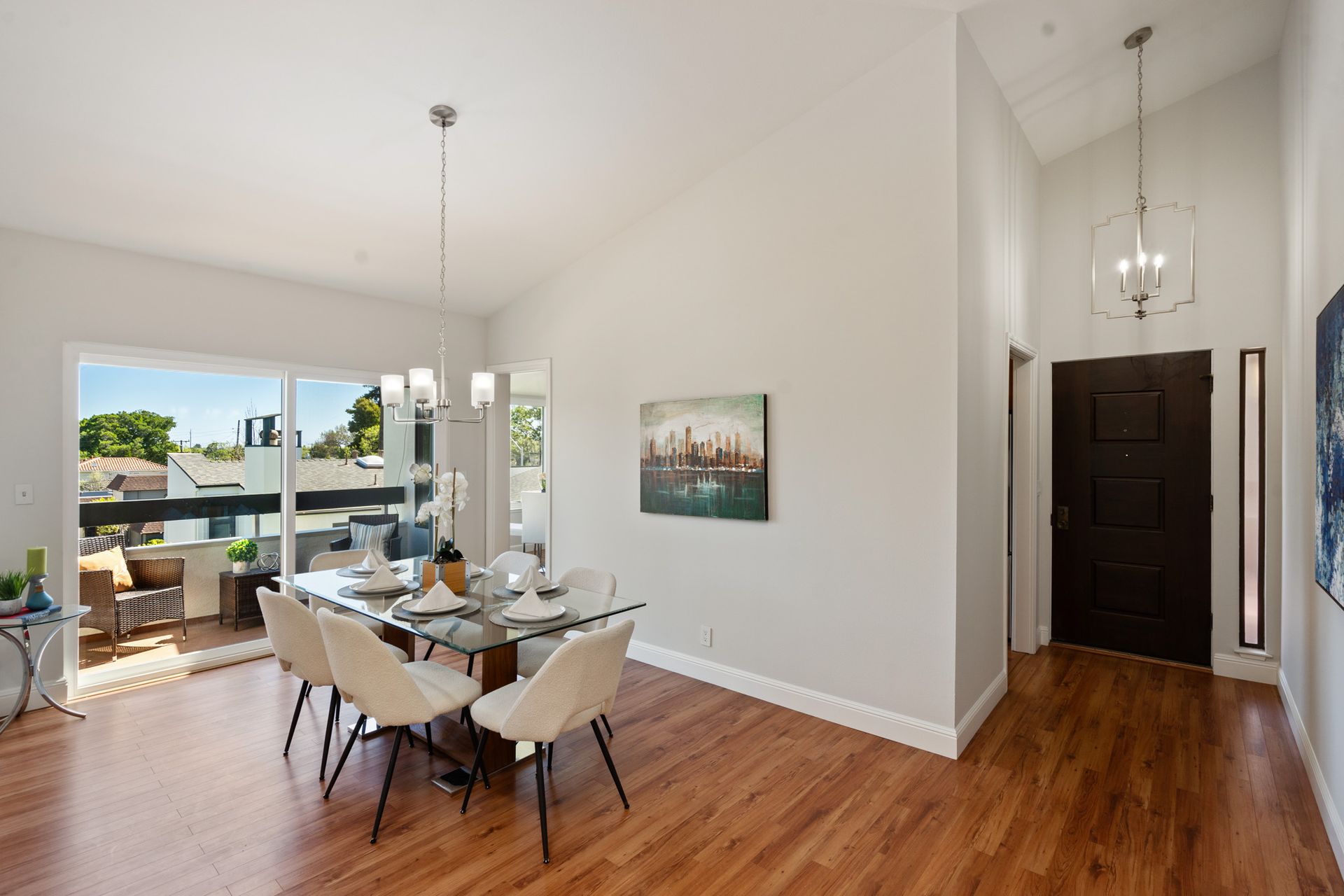 A dining room with a table and chairs in a house.