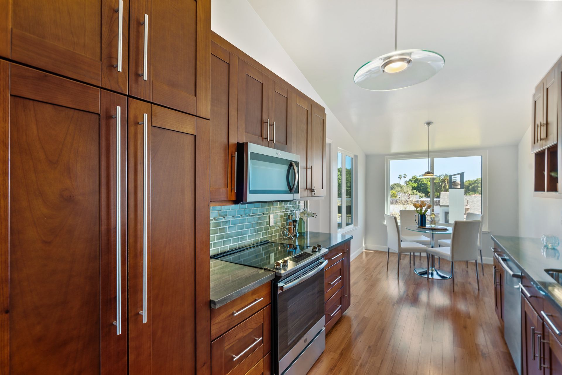 A kitchen with wooden cabinets and stainless steel appliances.