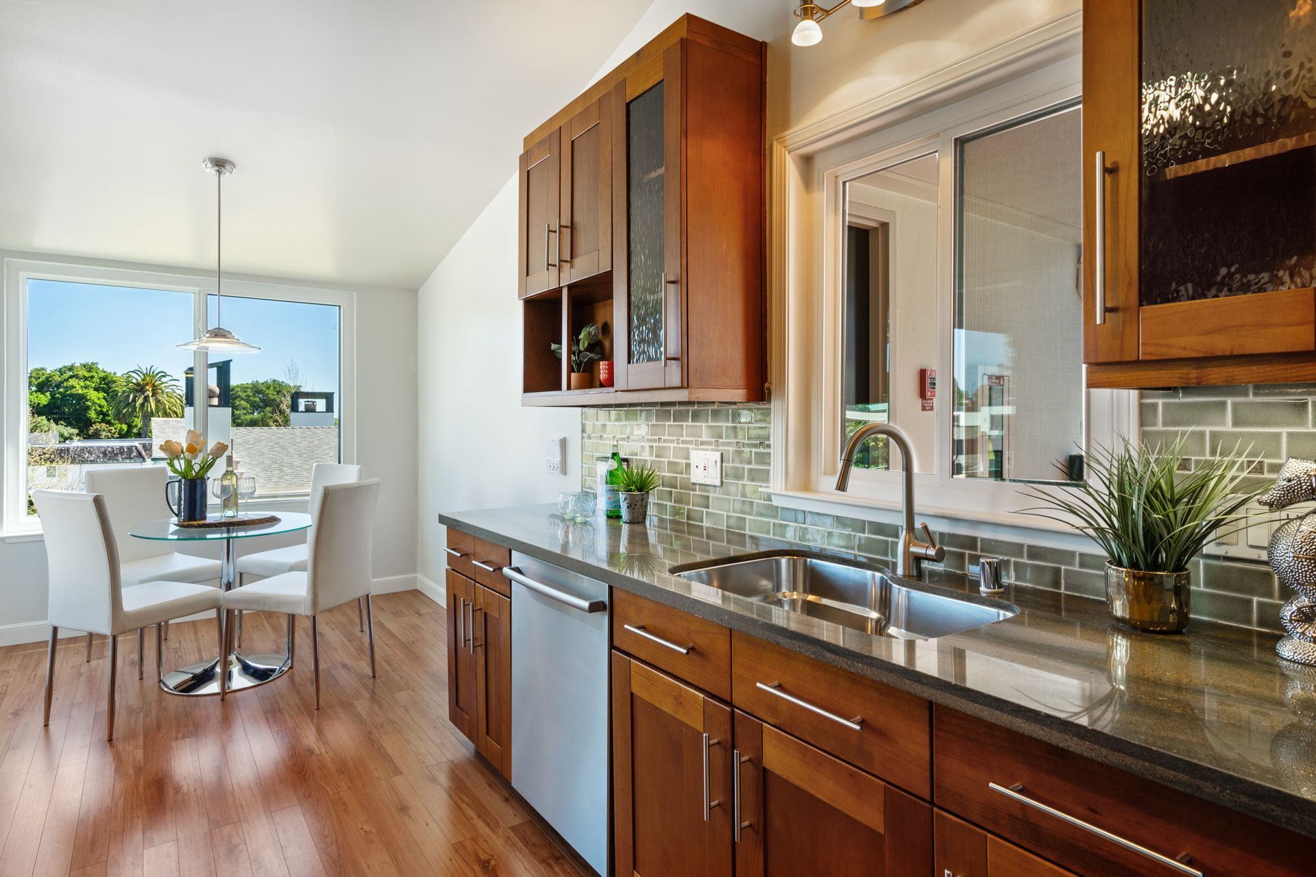 A kitchen with wooden cabinets and granite counter tops