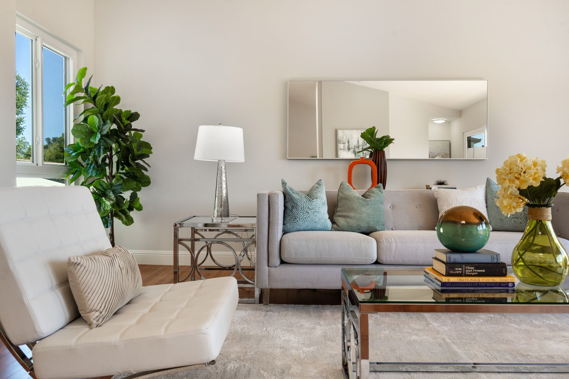 A living room with a couch a chair and a coffee table