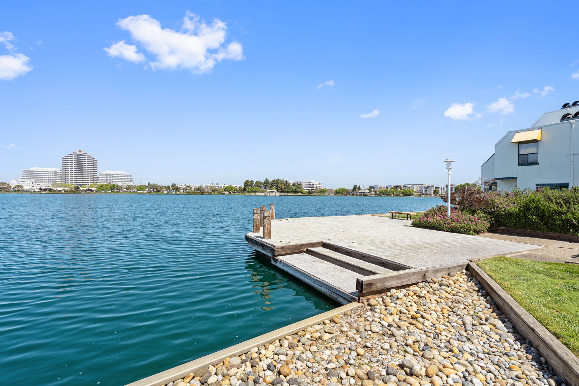 There is a dock in the middle of a lake.