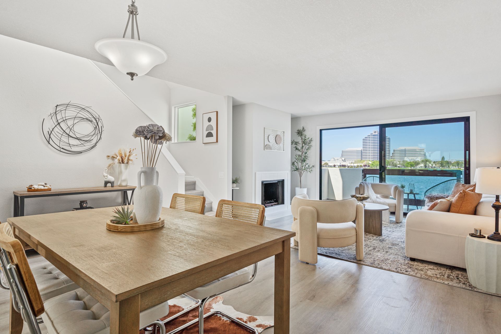 A living room with a wooden table and chairs