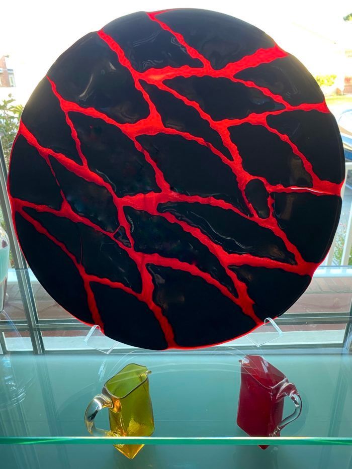 A black plate with red lines on it