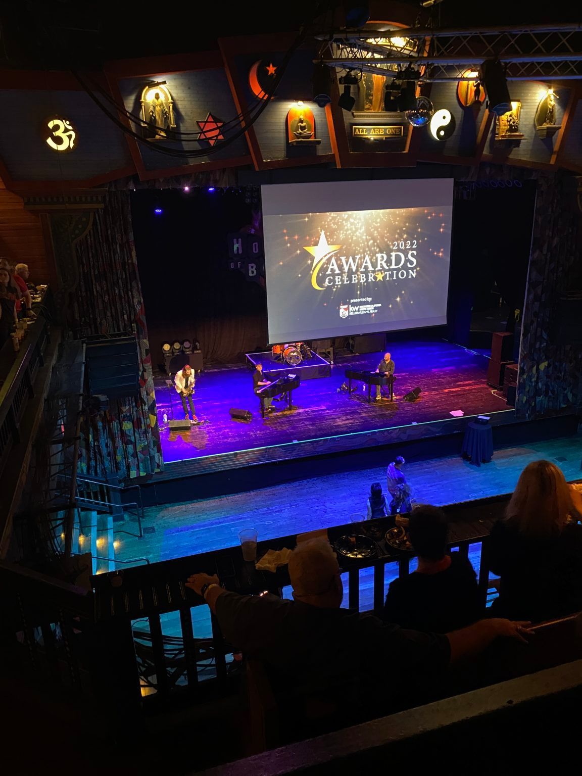 A stage with a screen that says awards on it