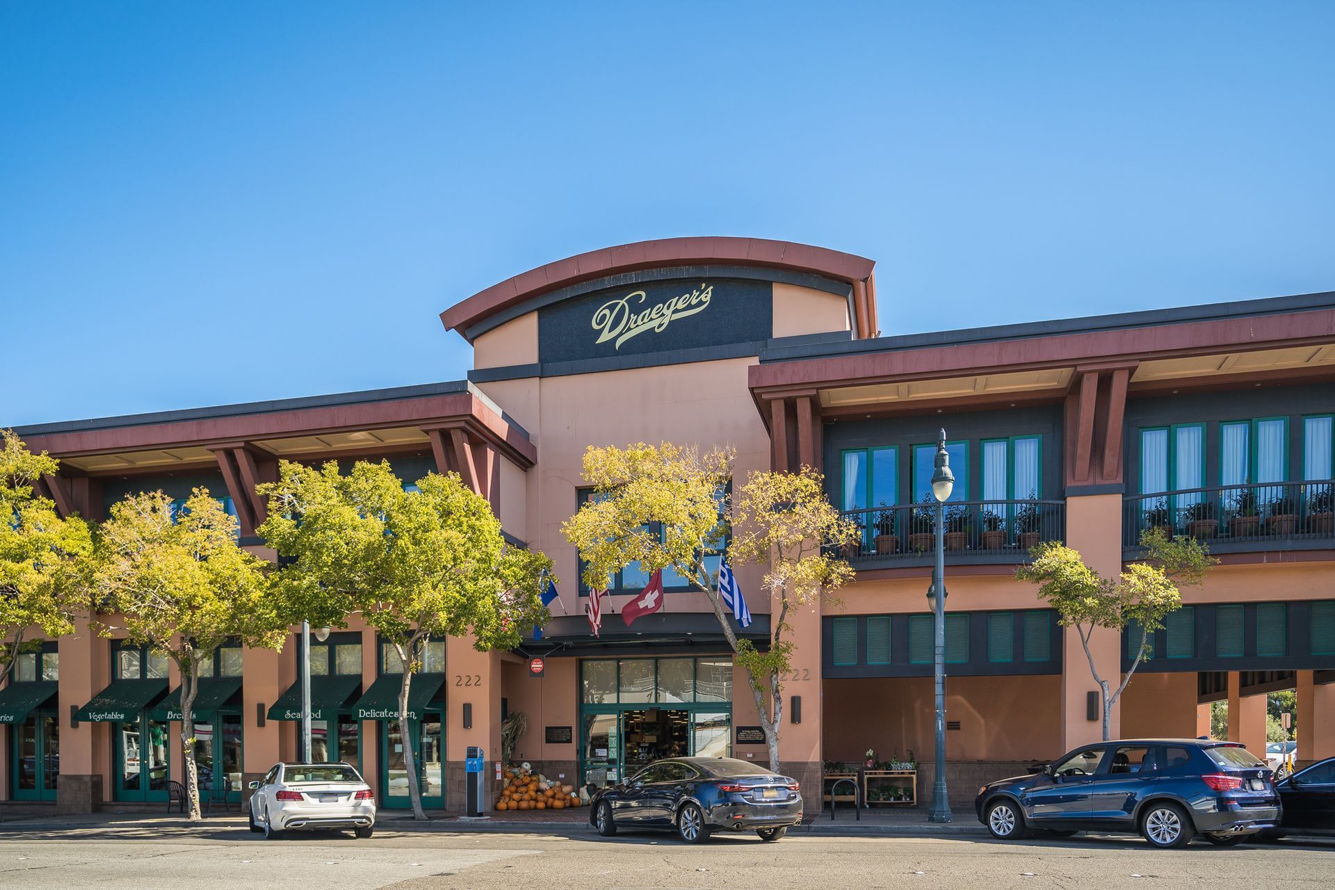 A large building with cars parked in front of it
