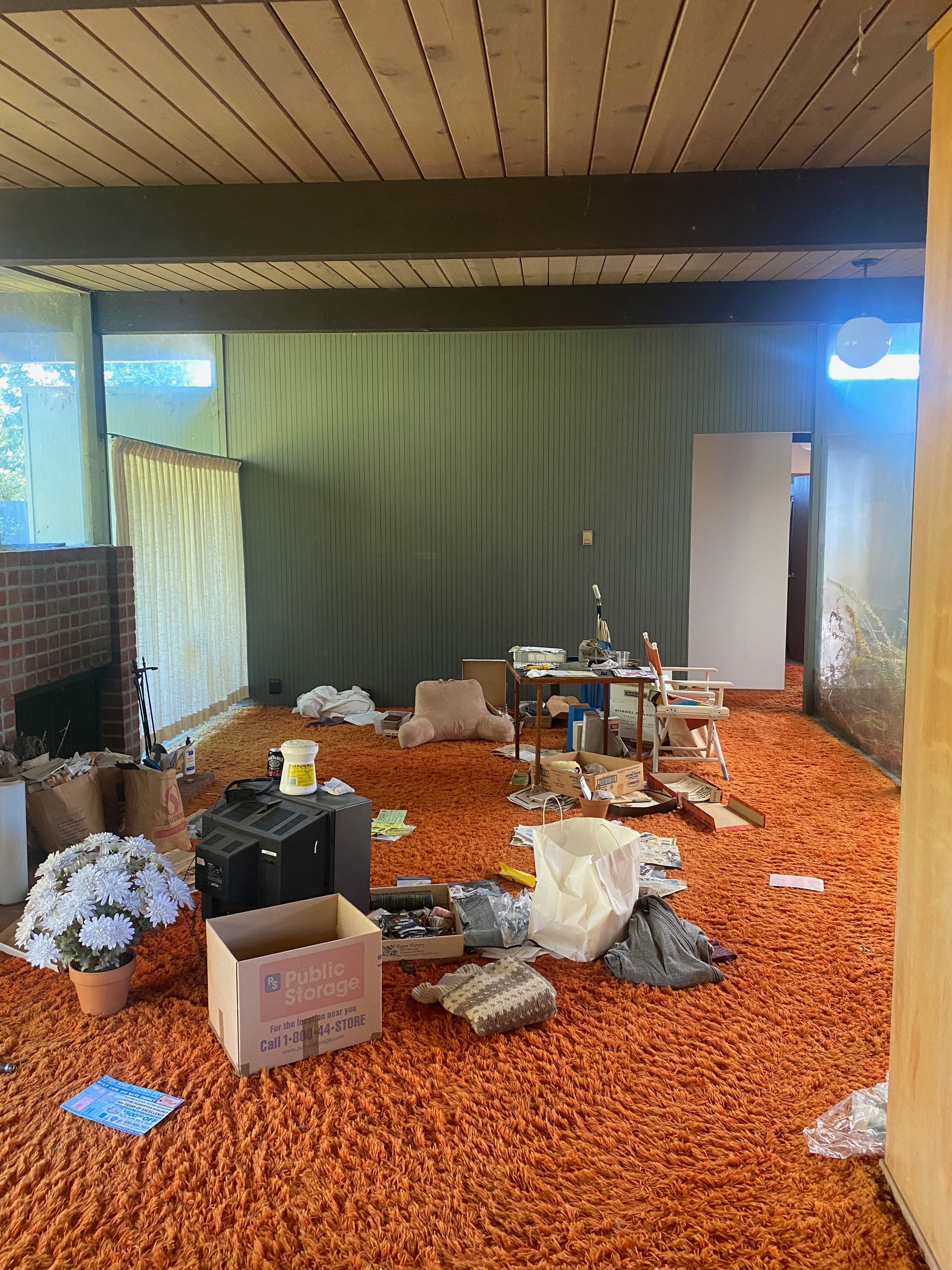 A living room with a couch , chairs and tables