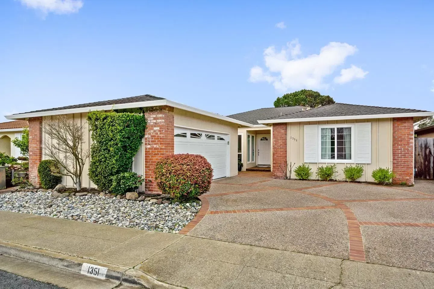 The front of a house with a garage and a driveway