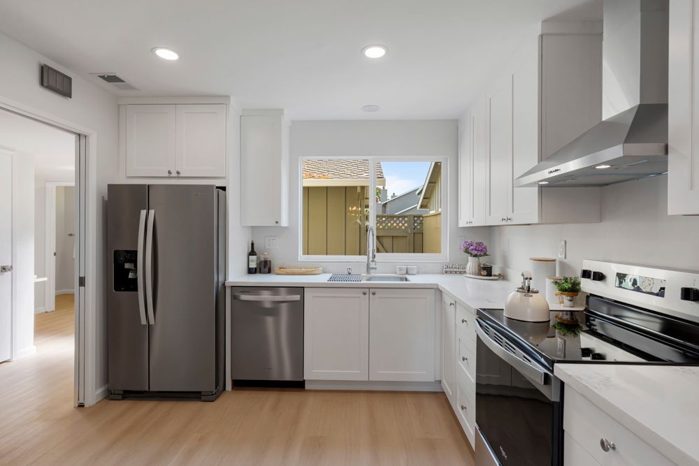 Renovated Foster City kitchen with shaker cabinets, quartz counters, and stainless appliances, listed by Rumana Jabeen Realtor.