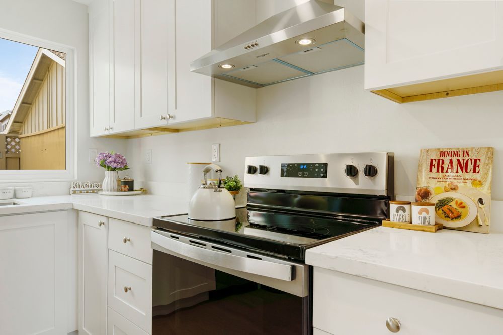 Renovated Foster City kitchen with shaker cabinets, quartz counters, and stainless appliances, listed by Rumana Jabeen Realtor.
