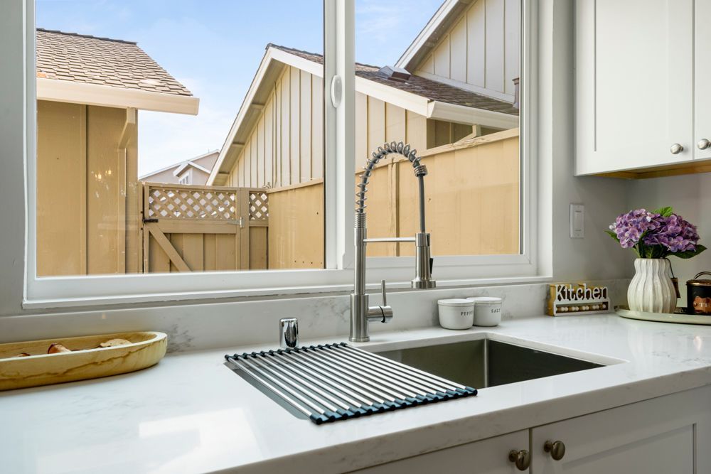 Renovated Foster City kitchen with shaker cabinets, quartz counters, and stainless appliances, listed by Rumana Jabeen Realtor.