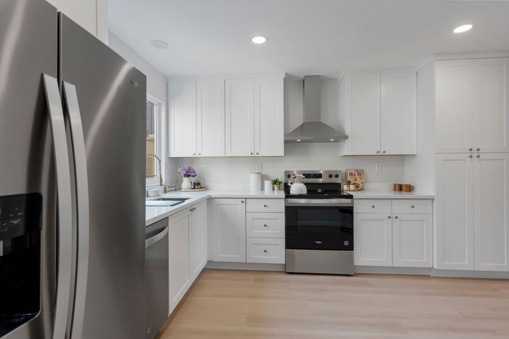Renovated Foster City kitchen with shaker cabinets, quartz counters, and stainless appliances, listed by Rumana Jabeen Realtor.