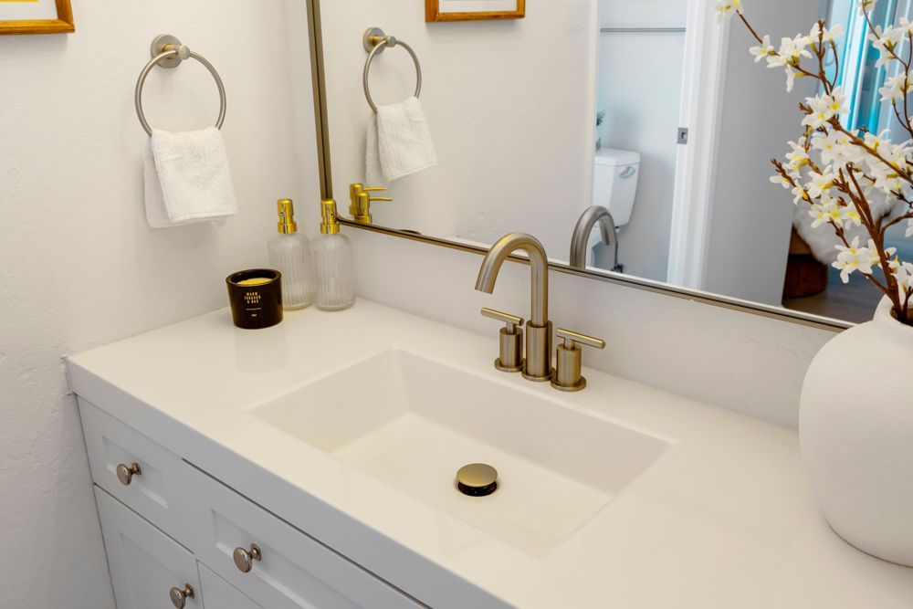 Updated primary bathroom with quartz vanity, glass shower, and walk-in closet, listed with Foster City Realtor Rumana Jabeen.