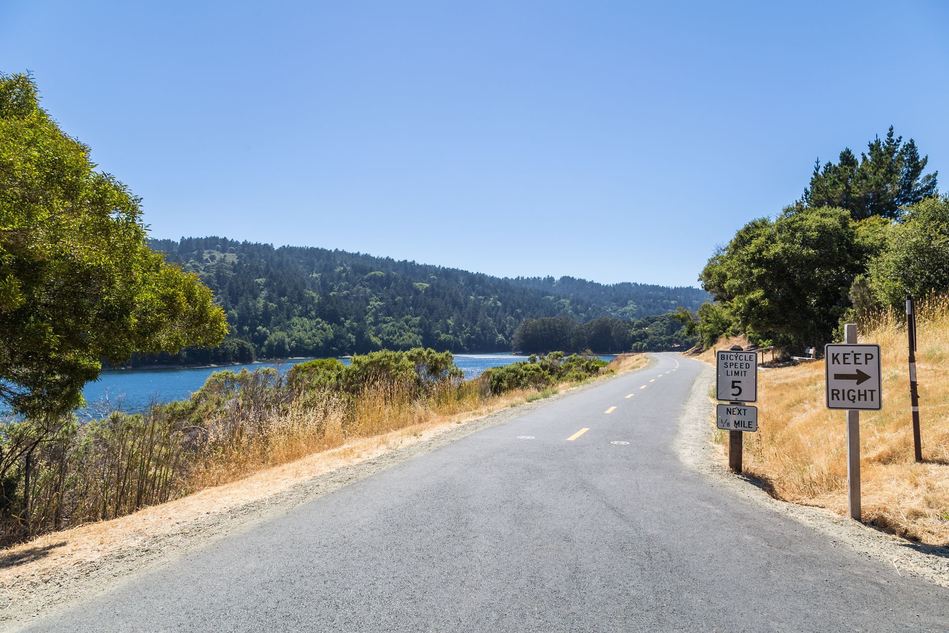 A road with a sign that says keep right