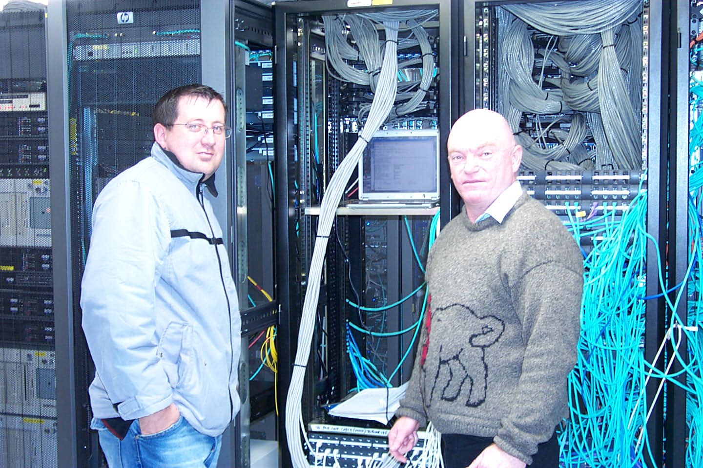 electricians in front of their work