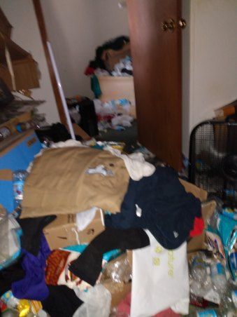 A room filled with lots of clothes and boxes