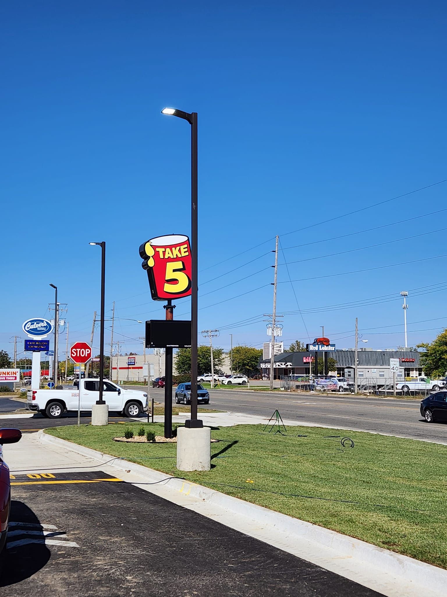 A Parking Lot with a Sign that Says Trace 5.