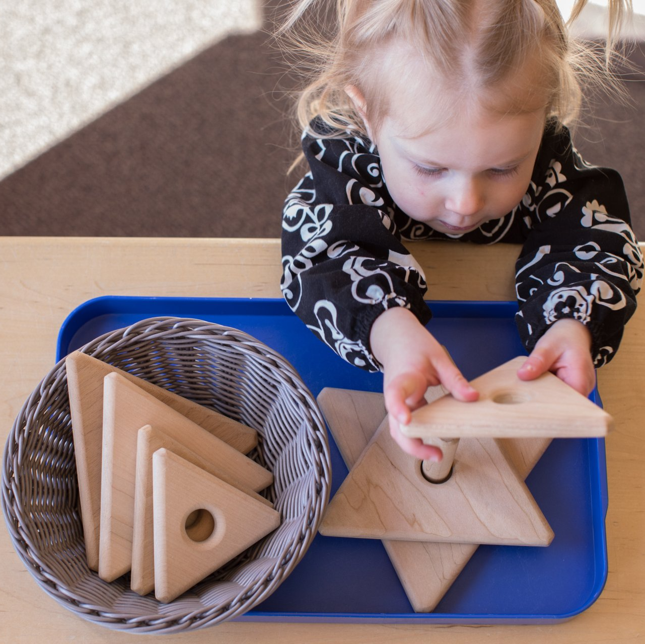 Child working with Montessori materials