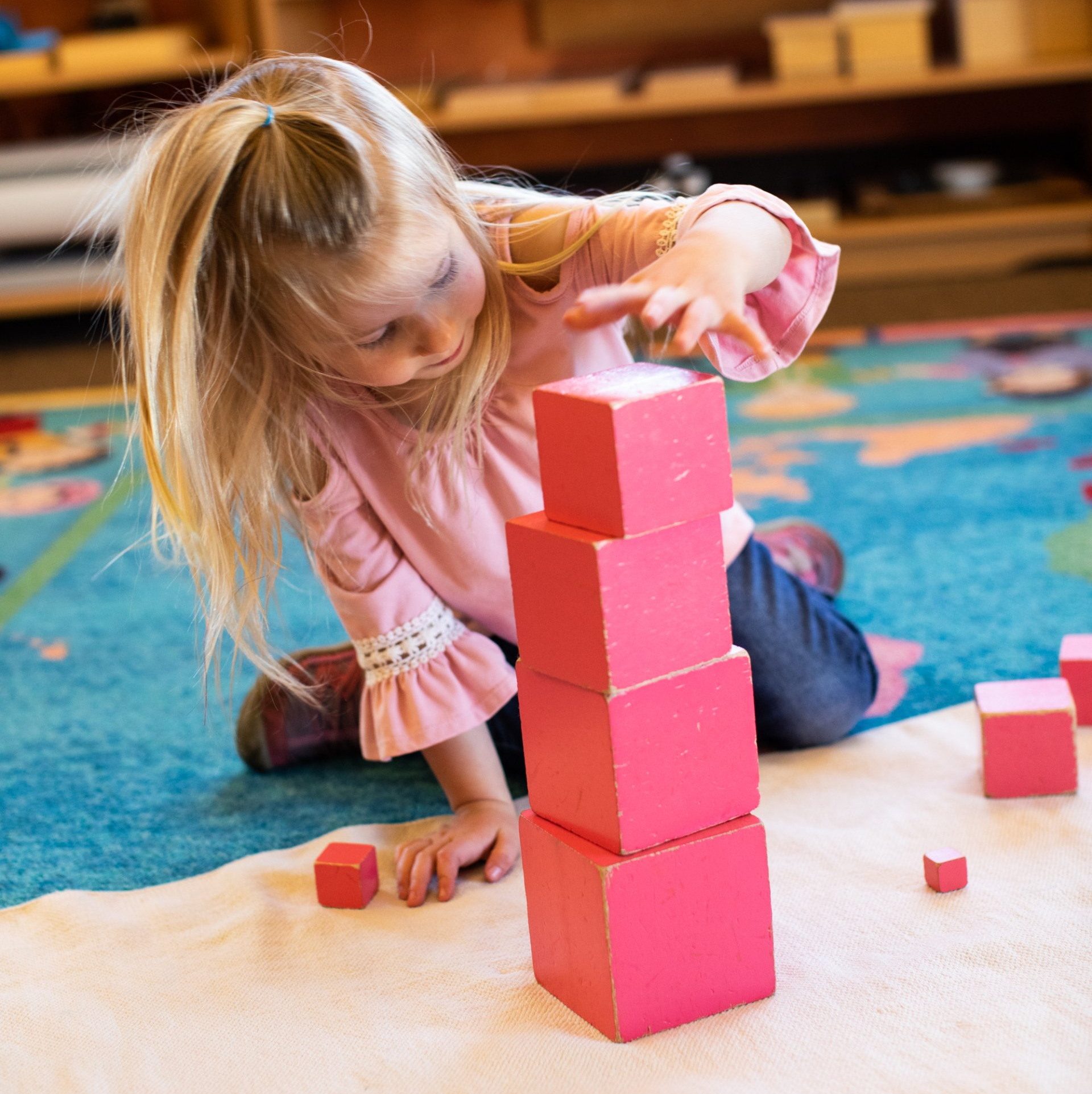 Child working with the Pink Tower