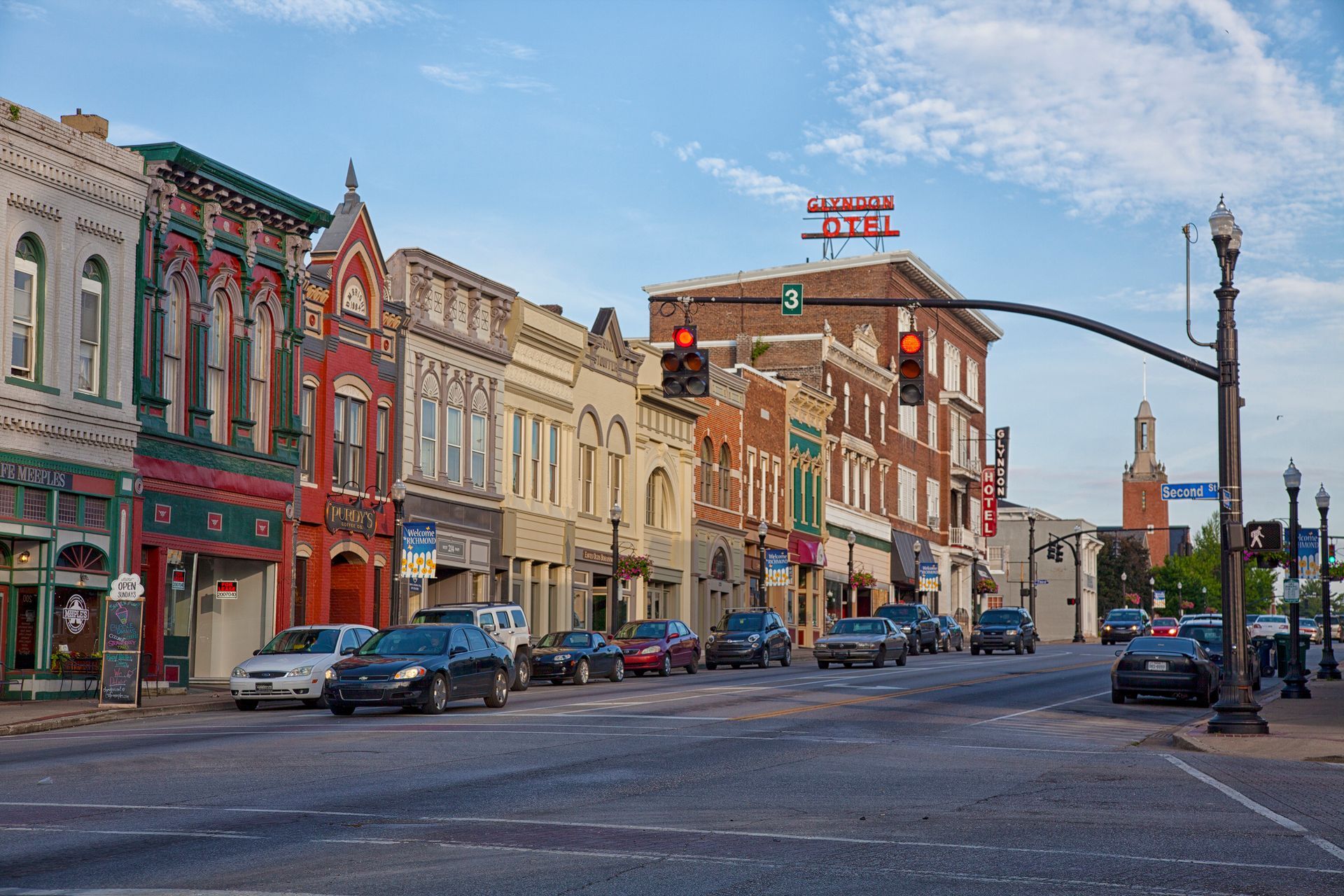 A city street with a lot of buildings and cars on it
