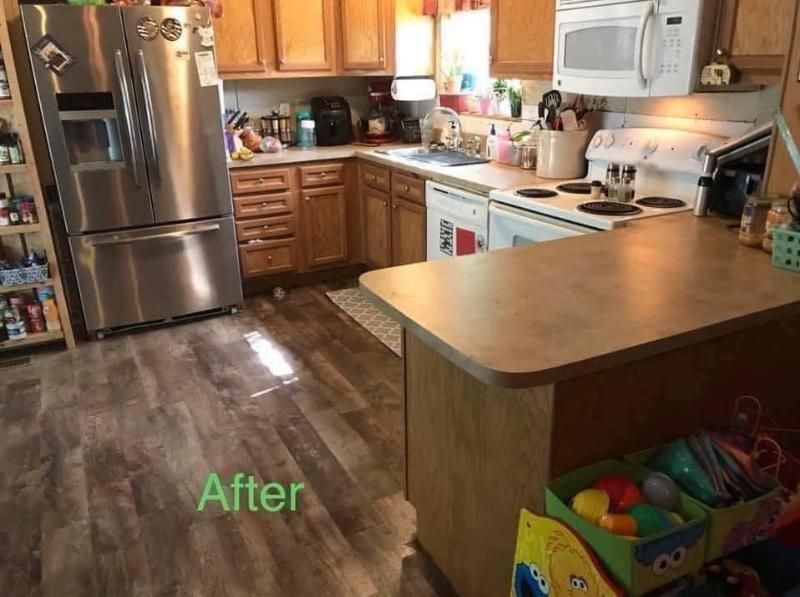 Kitchen with wood cabinets, stainless steel fridge, and island, labeled 