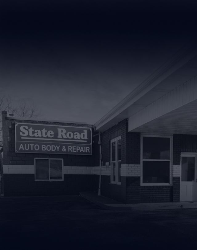 A brick building with a sign that reads