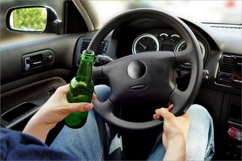 Man drinking and driving