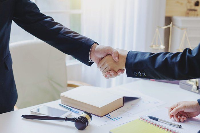 Lawyer and Client Shaking Hands — Columbia, SC — Law Offices of Robert Dodson