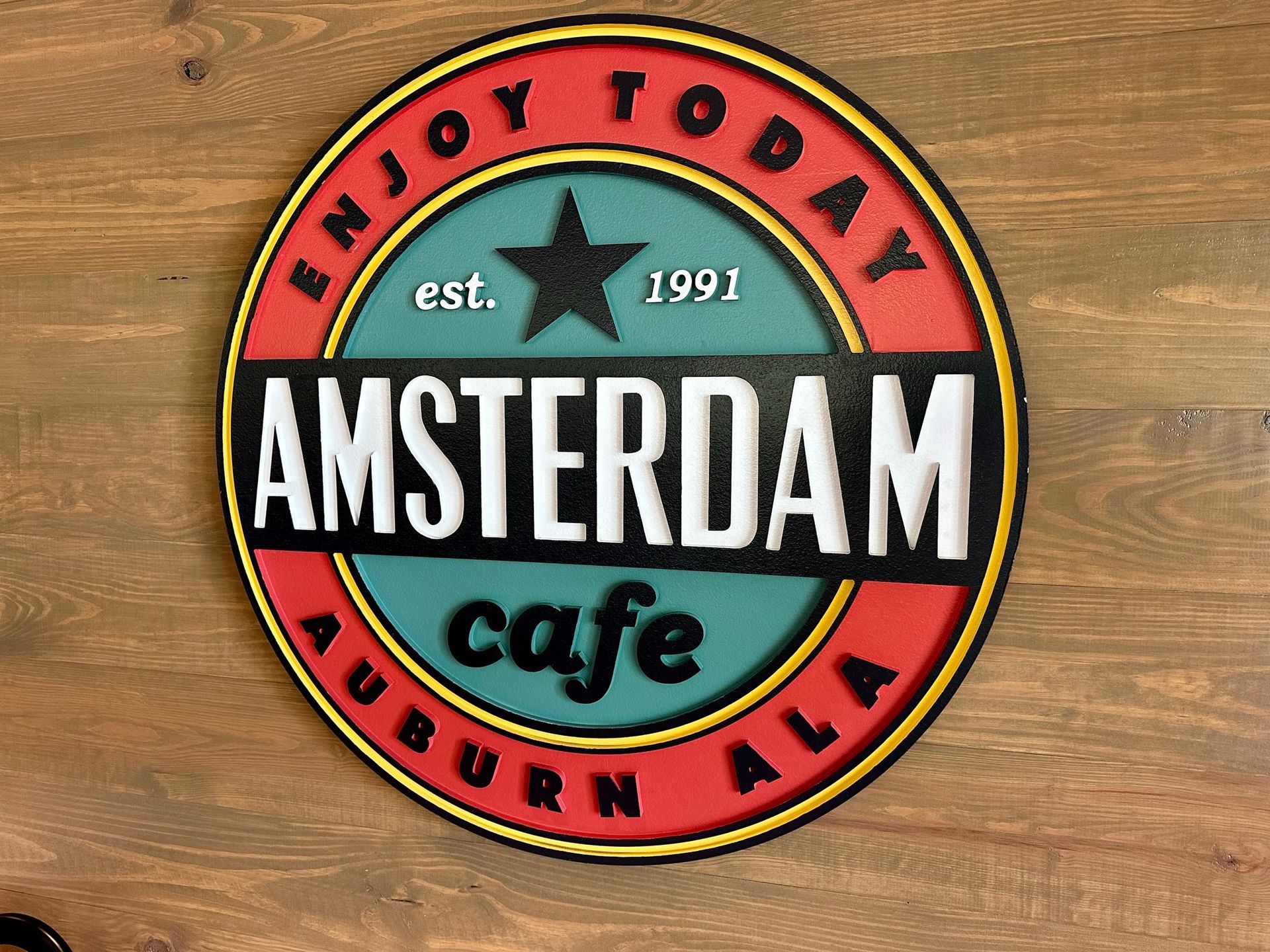 A sign that says amsterdam cafe on it