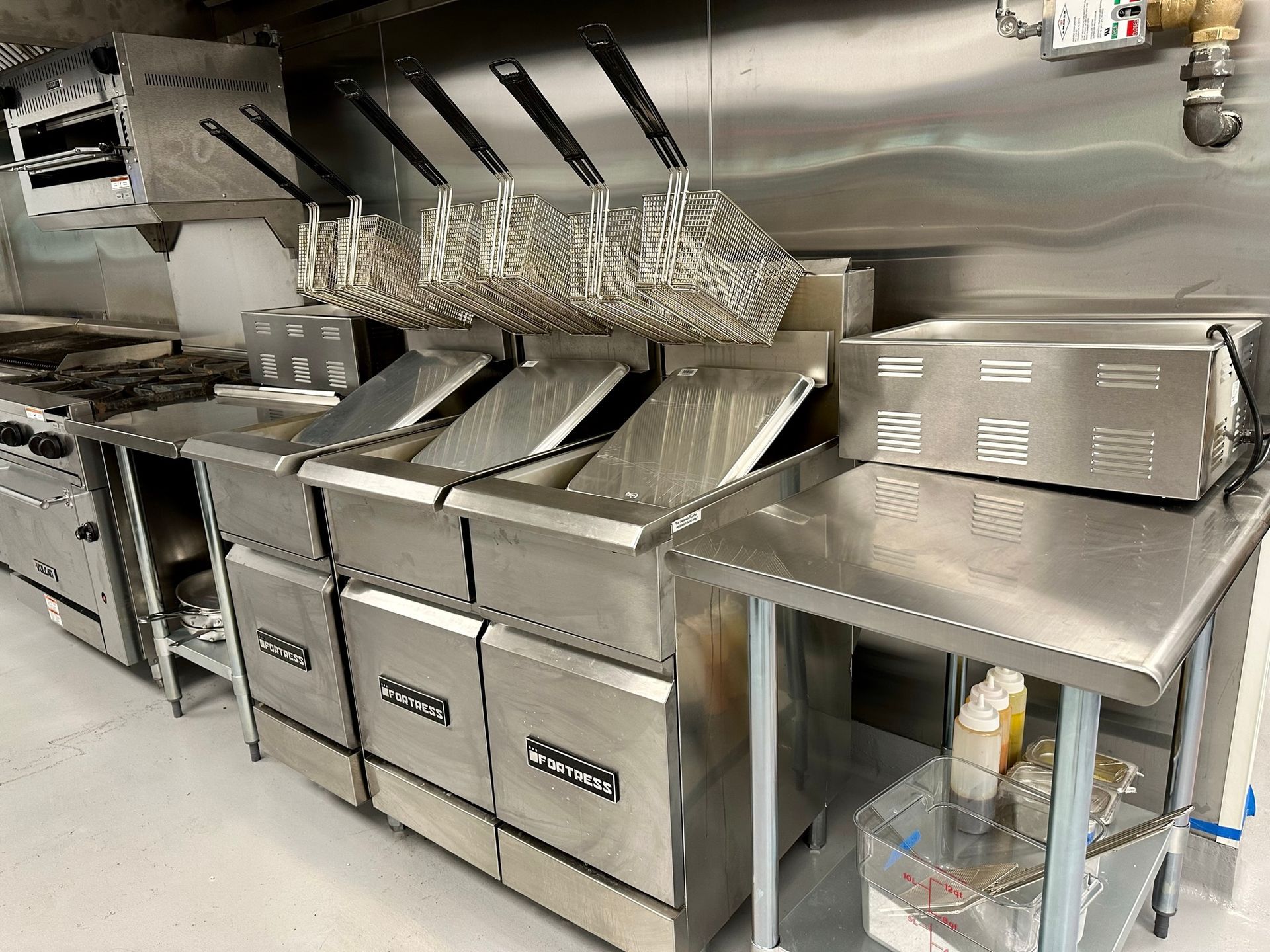 A kitchen with a lot of stainless steel appliances