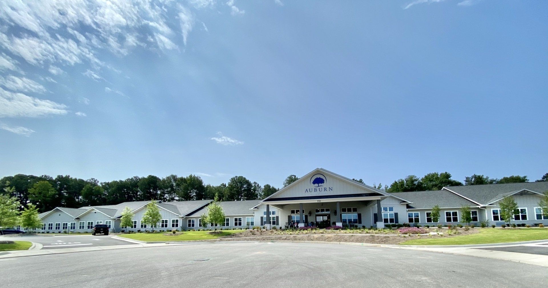 A large white building with a blue sky in the background.