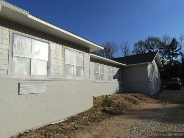 A white house with a blue sky in the background