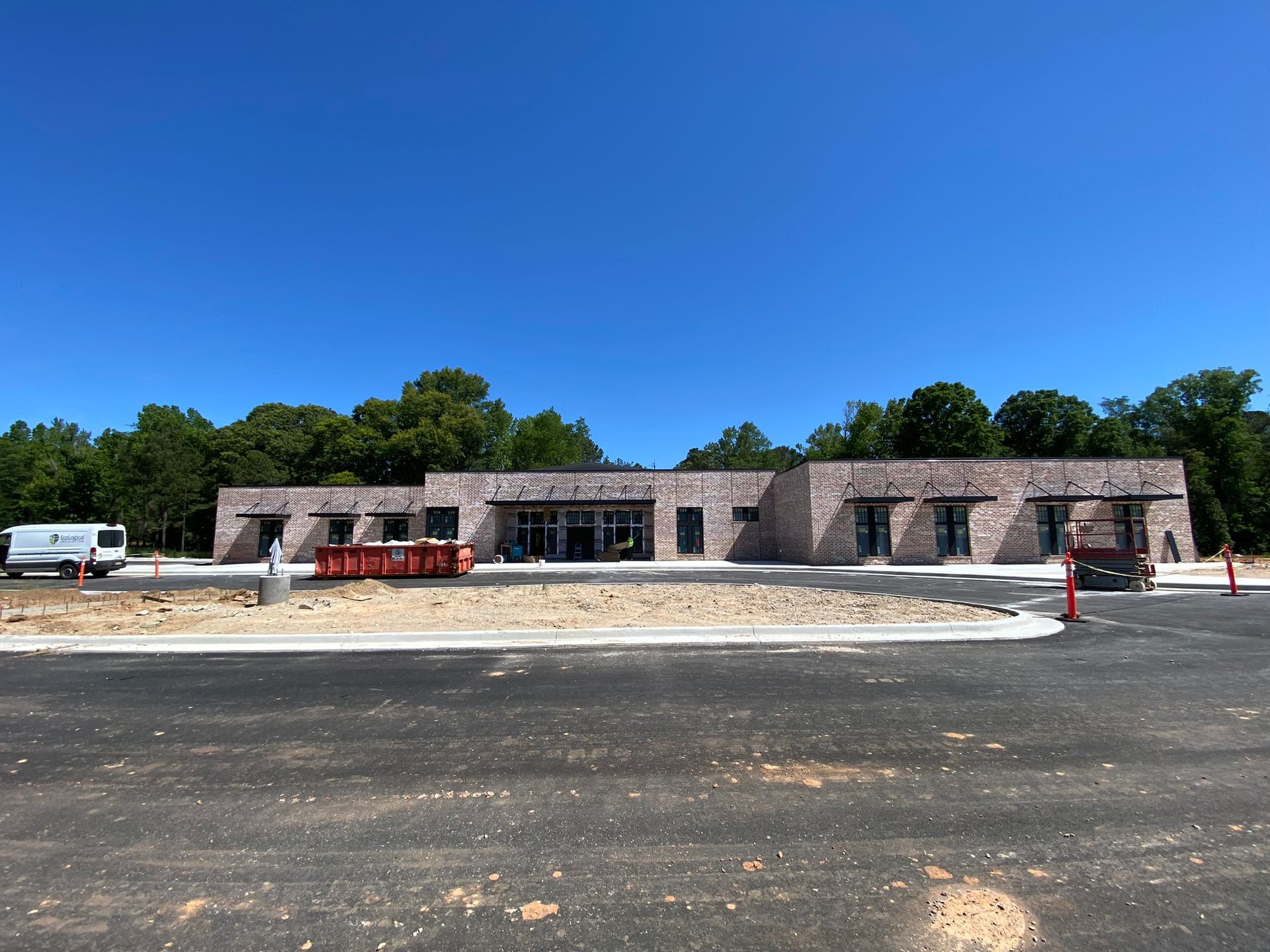 A building under construction with a blue sky in the background