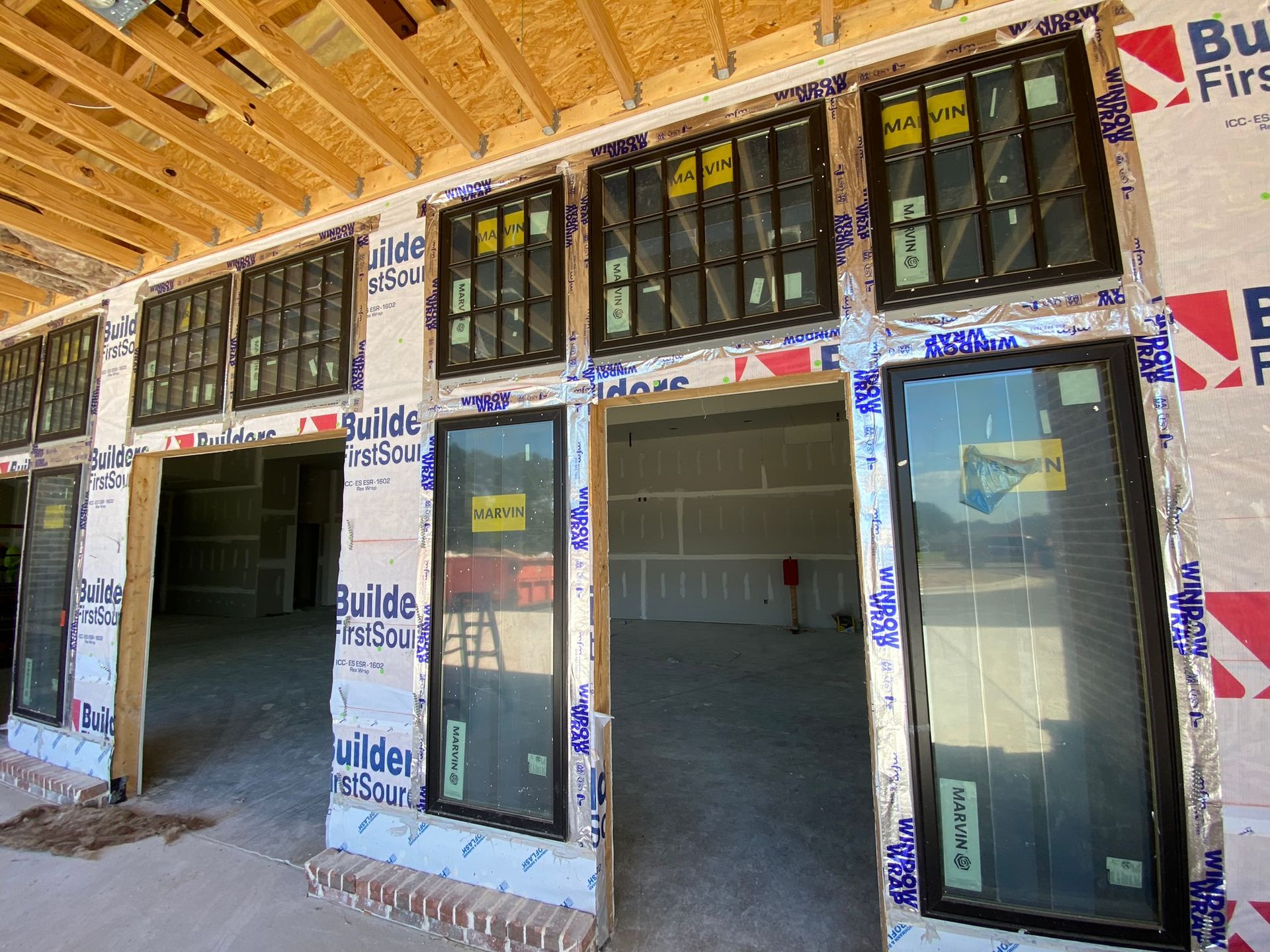 A building under construction with a lot of windows.
