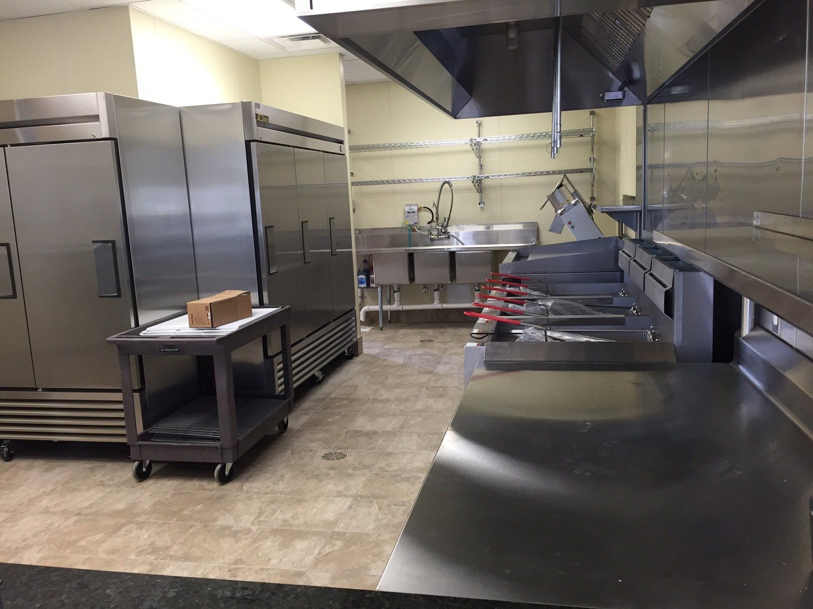 A kitchen with a lot of stainless steel appliances