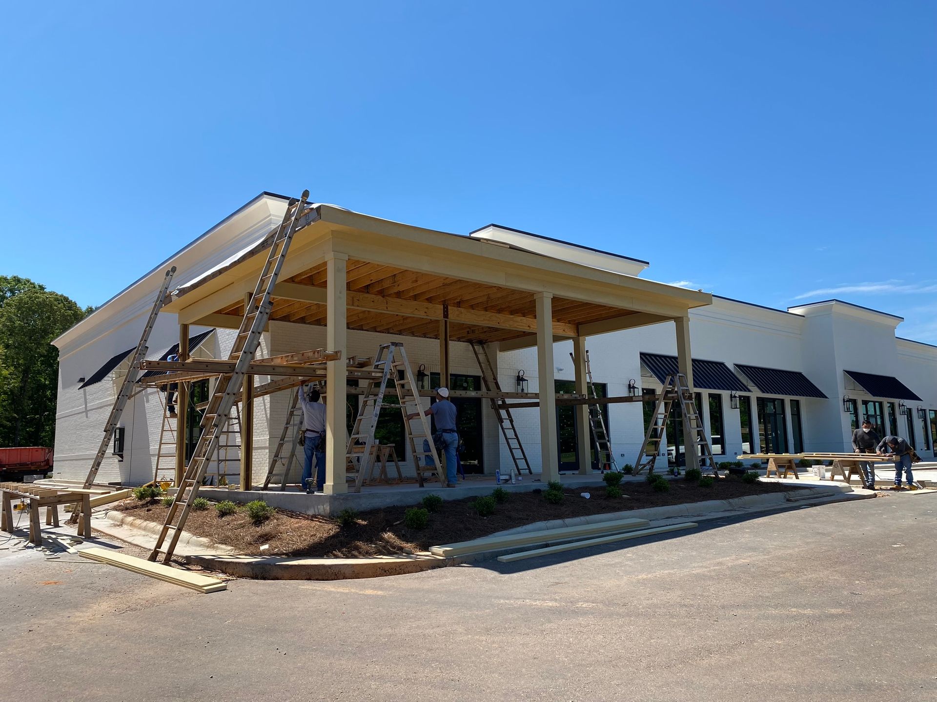 A group of people are working on a building under construction.